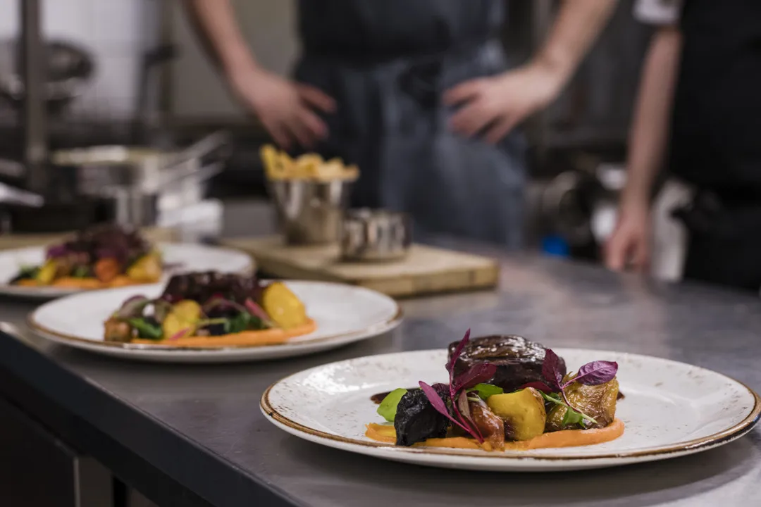 Several plates of delicious dishes ready to be served to the guests